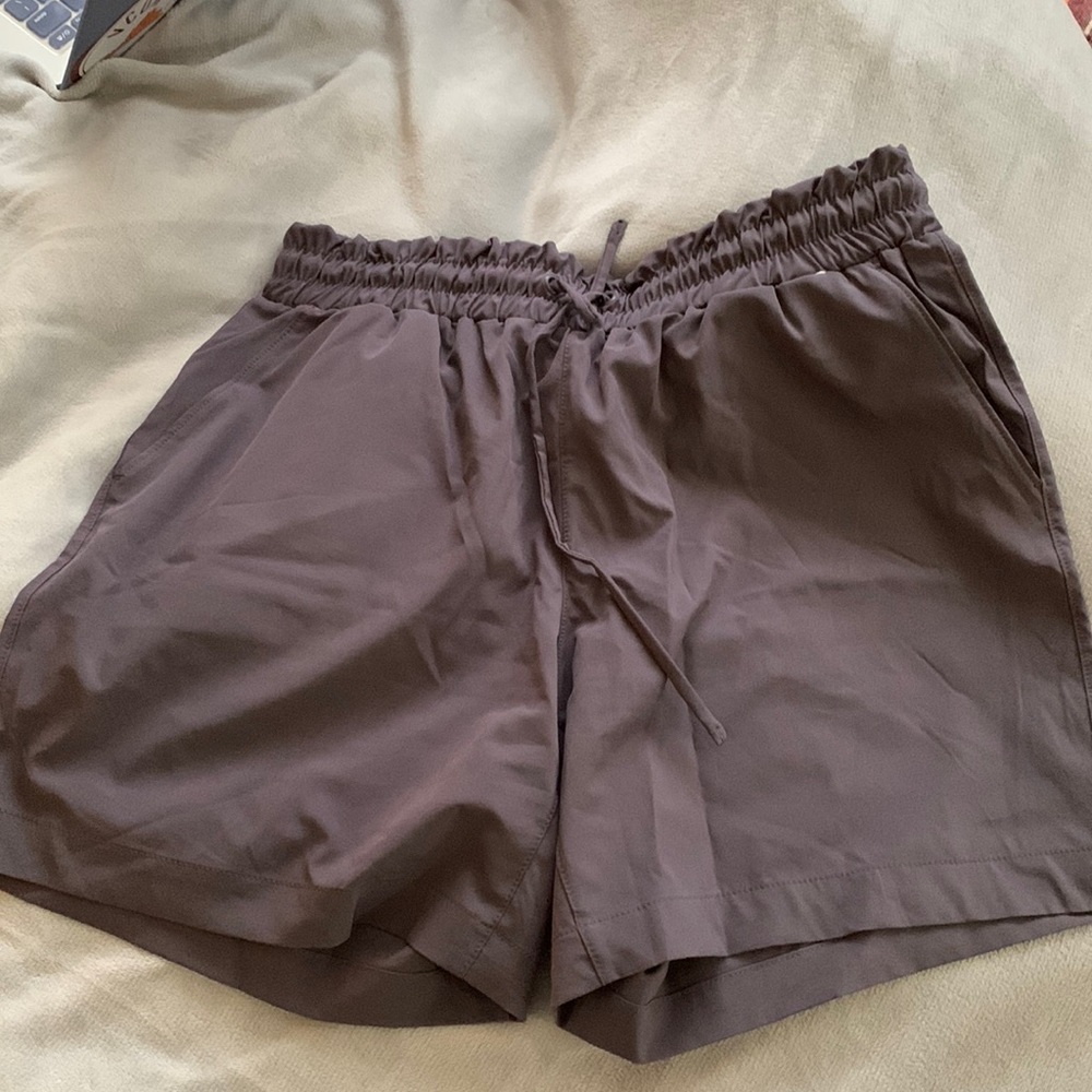 Purple drawstring running shorts with pockets, size S